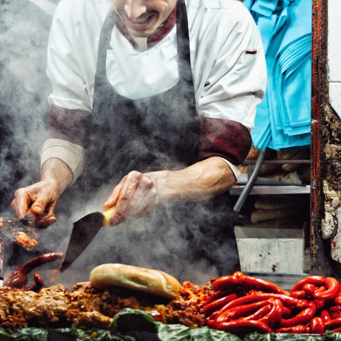 Cook grilling street food in a Moroccan market